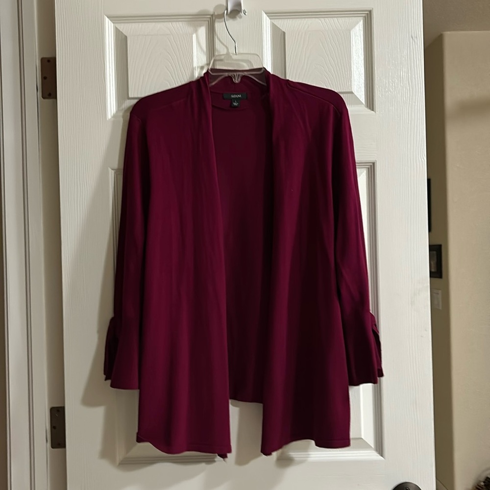Winter flyaway cardigan.  Long sleeve with a bell hem with a bow. Very dressy.